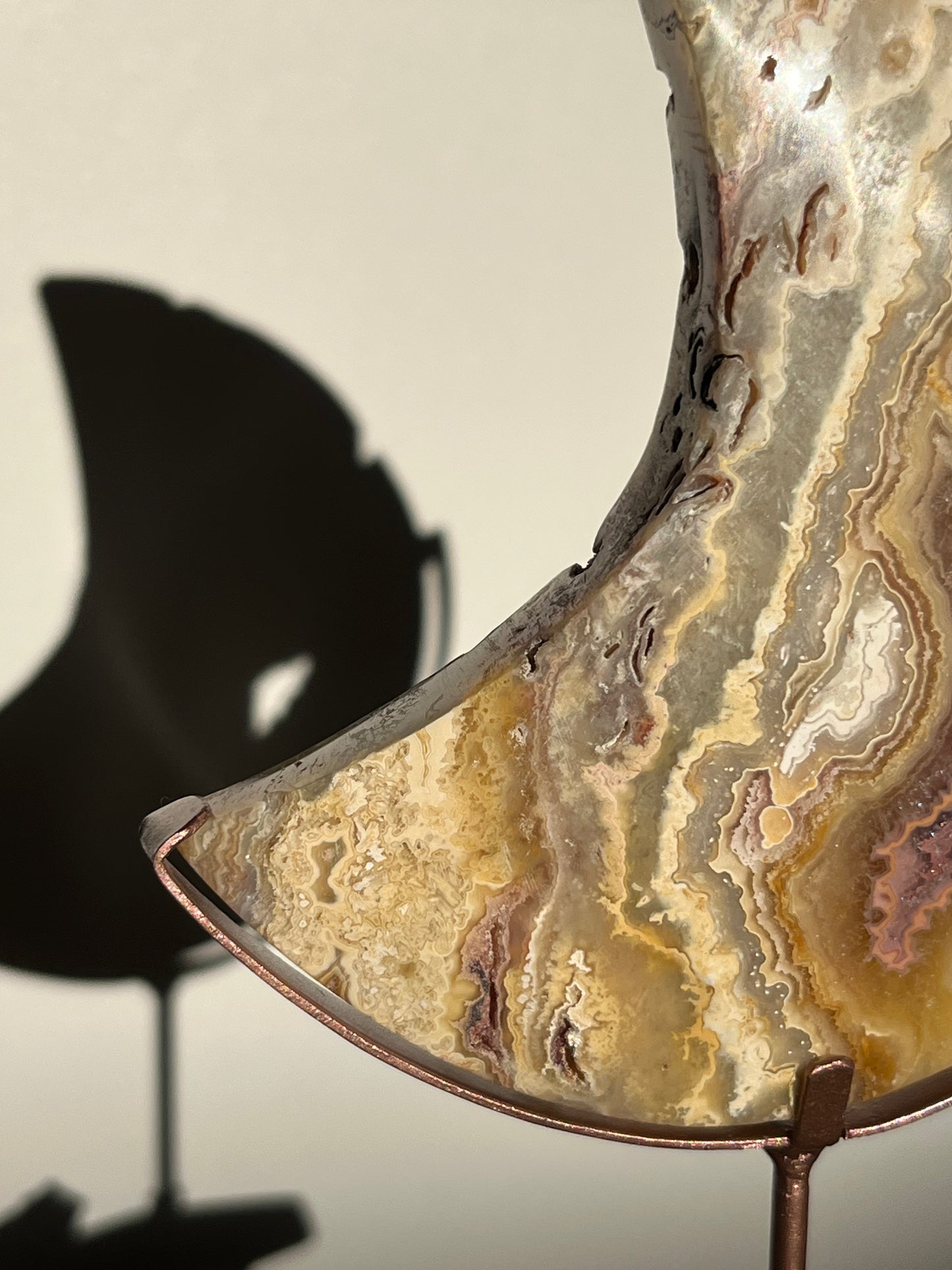 Golden Lace Agate Moon Carving on Rose Gold Coloured Stand A