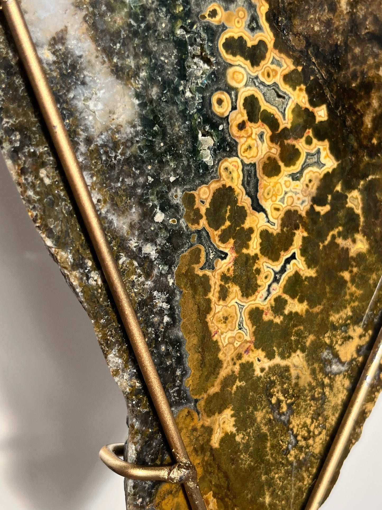 Multicoloured River Jasper Slab with Dendritic Inclusions on Rotating Gold Coloured Stand
