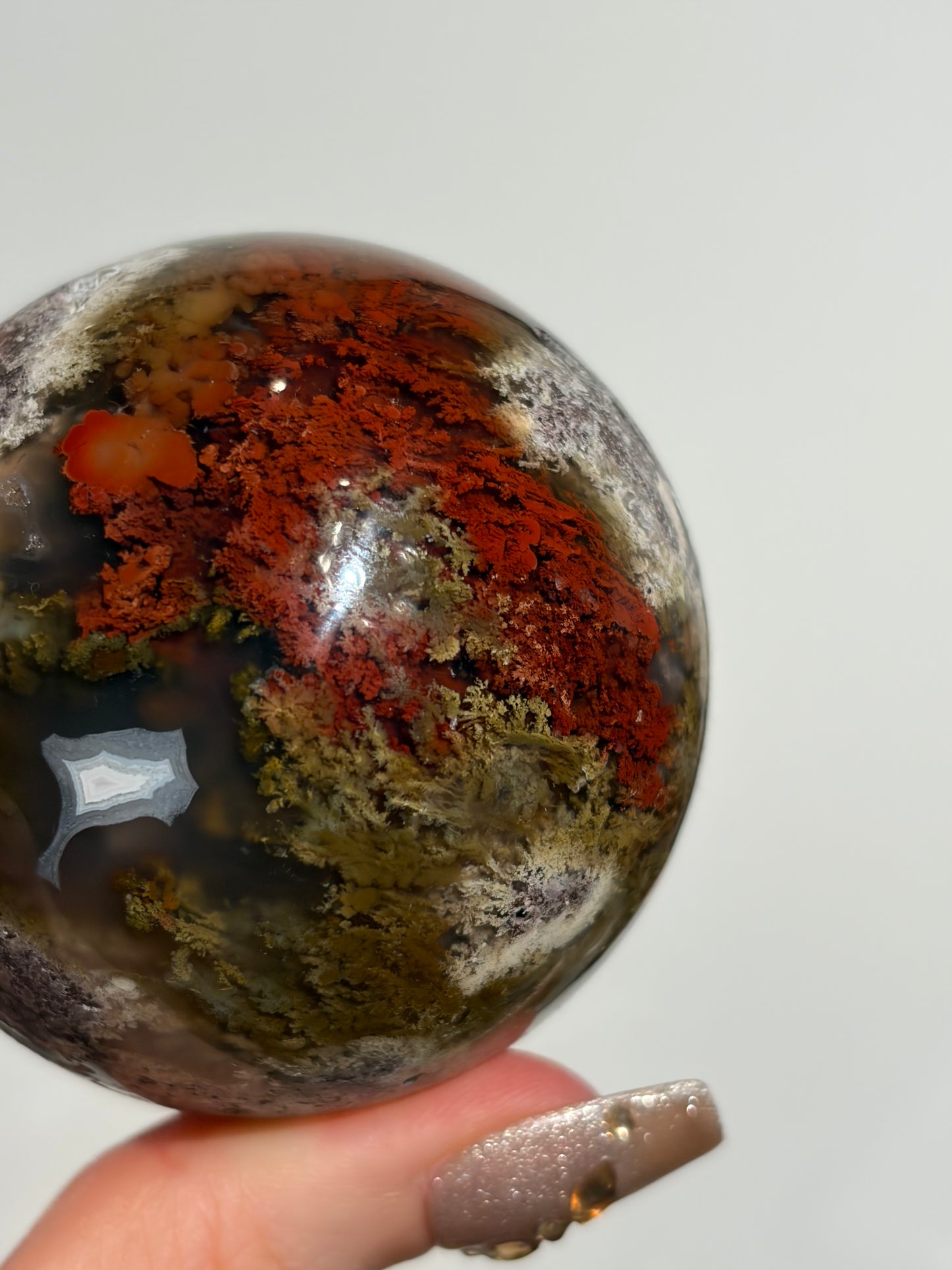 “Crimson Veils” Nebula Agate Sphere with Red Moss B