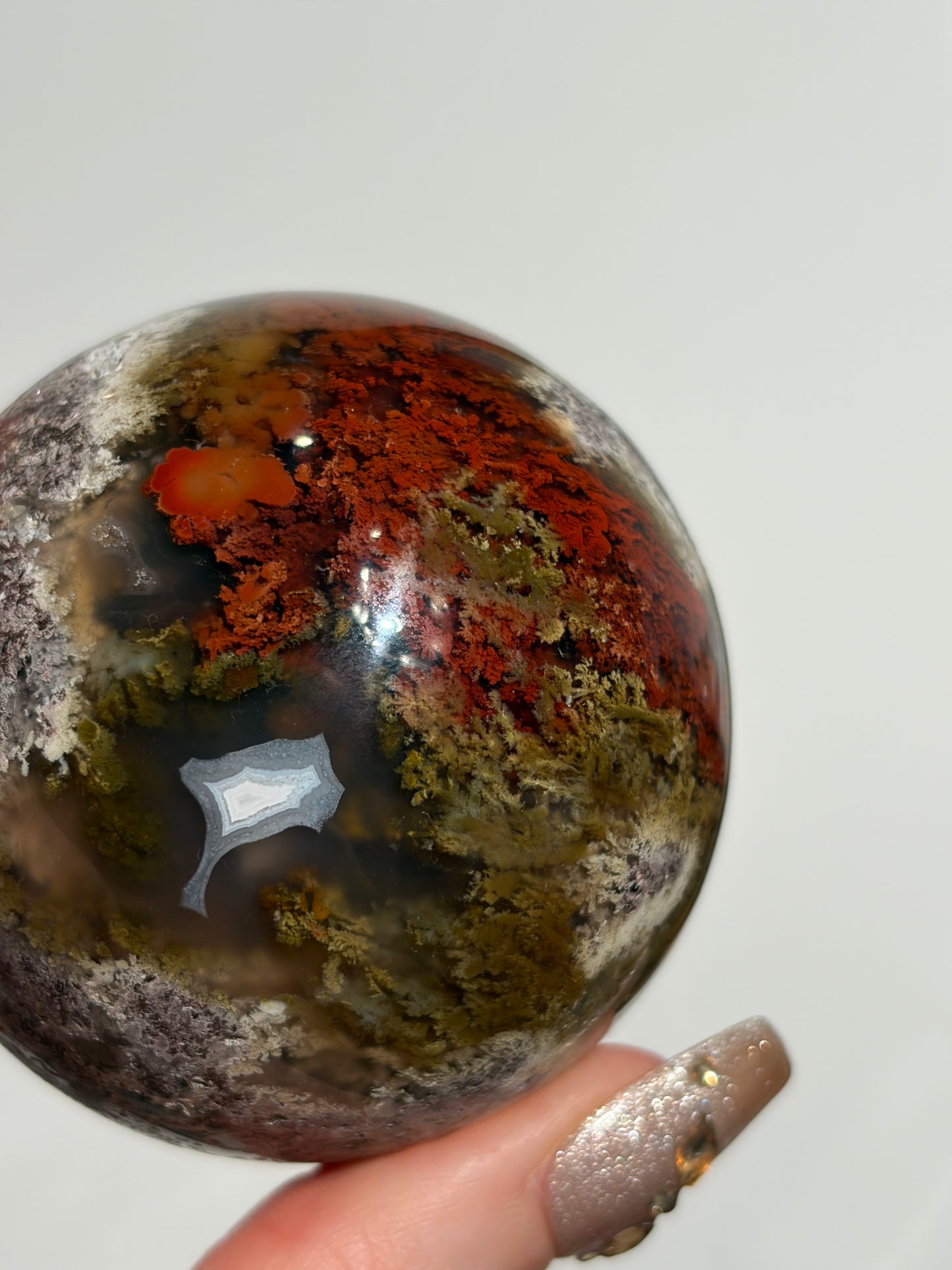 “Crimson Veils” Nebula Agate Sphere with Red Moss B