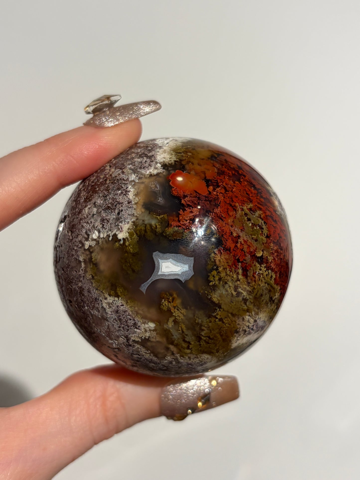 “Crimson Veils” Nebula Agate Sphere with Red Moss B