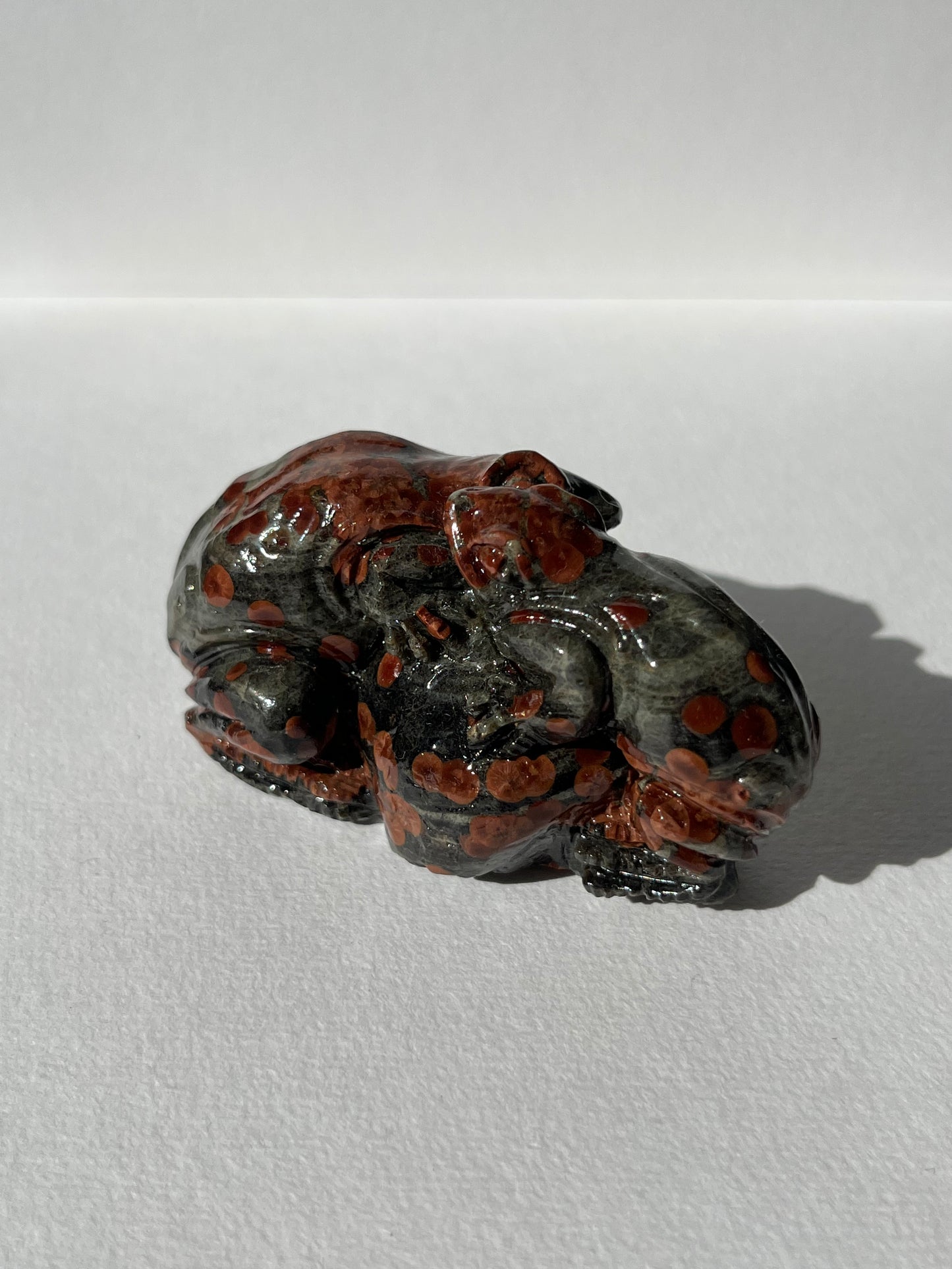 “Embrace” Peanut Obsidian Frog Carving