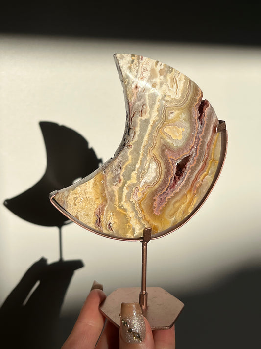 Golden Lace Agate Moon Carving on Rose Gold Coloured Stand A