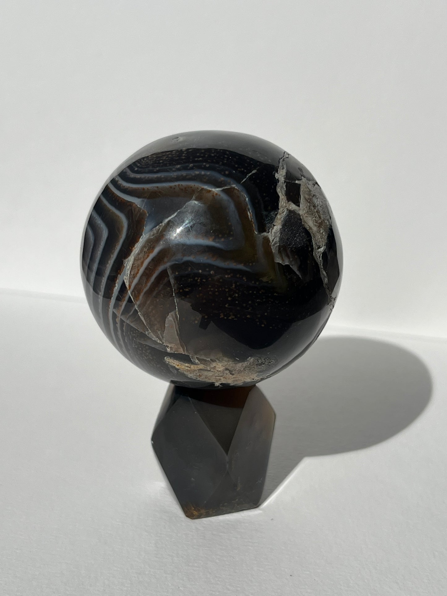 Purple Banded Agate Sphere on Geometric Faceted Crystal Stand A