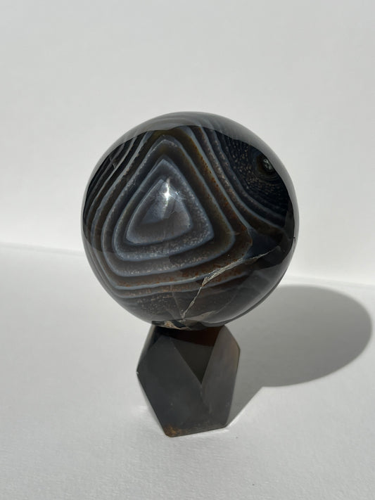 Purple Banded Agate Sphere on Geometric Faceted Crystal Stand A