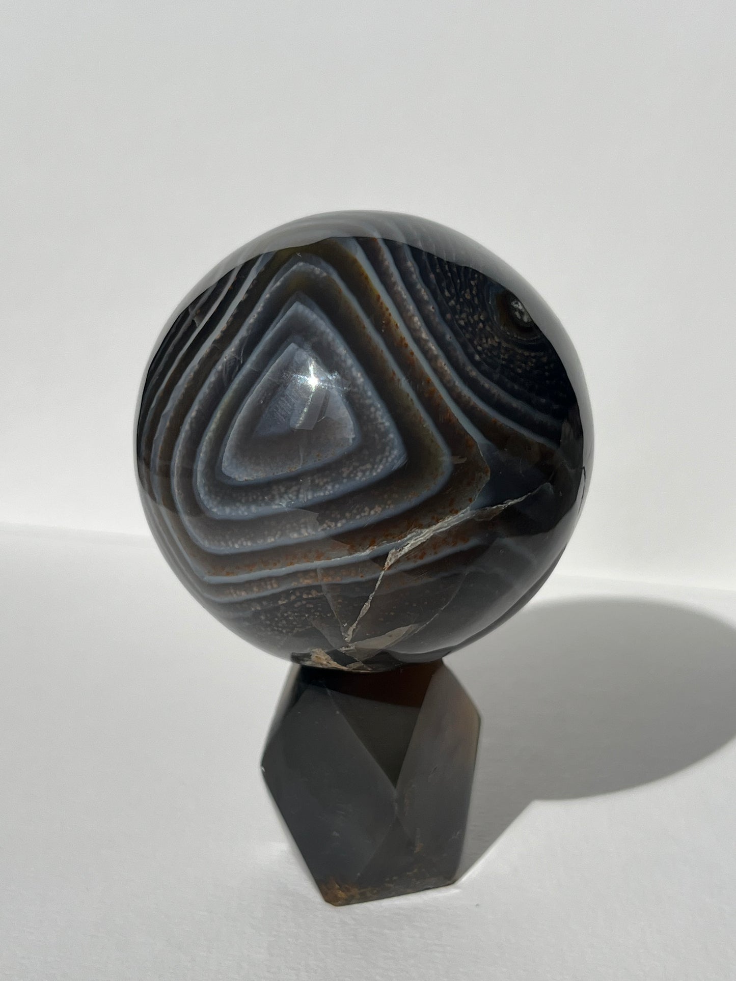 Purple Banded Agate Sphere on Geometric Faceted Crystal Stand A