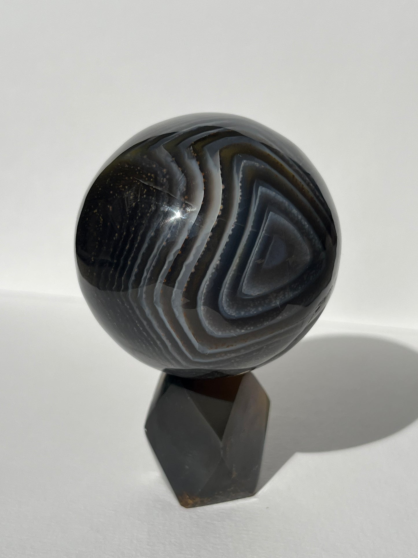 Purple Banded Agate Sphere on Geometric Faceted Crystal Stand A